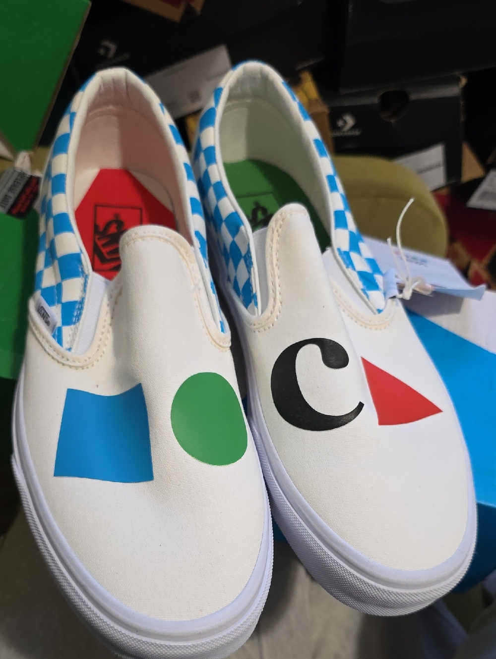 Vans White Slip-On Sneakers with Blue, Green, Black & Red Graphic Shapes